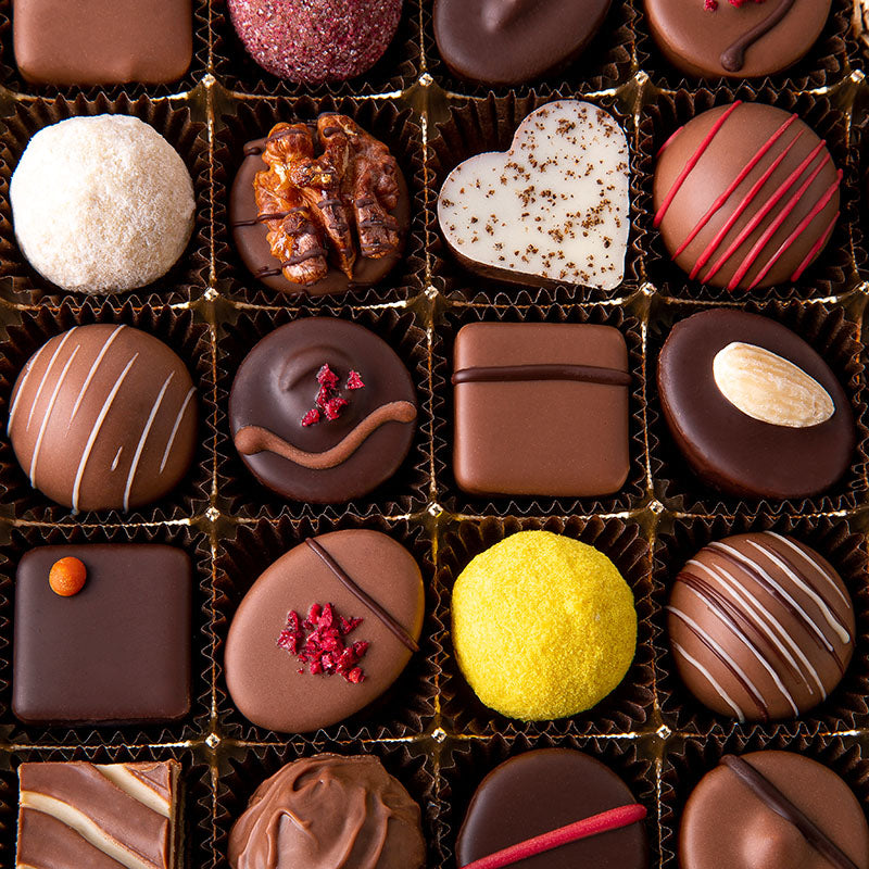 
                  
                    Bunte Mischung aus handgemachten Pralinen

                  
                